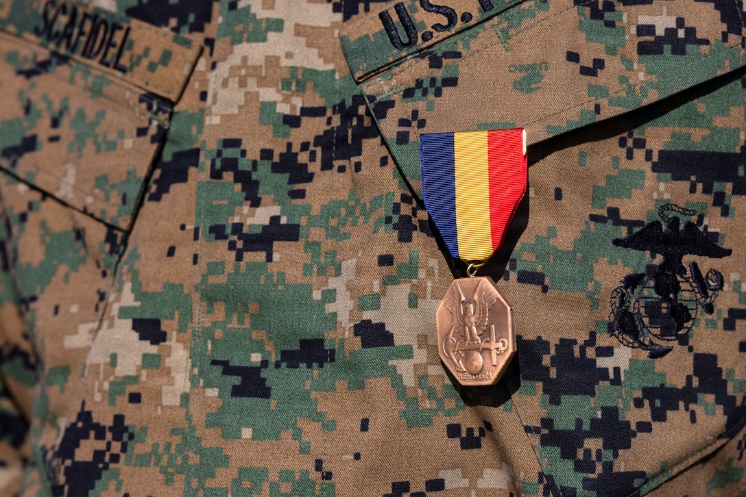 U.S. Marine Corps Staff Sgt. Billy Scafidel, an armory chief with 7th Engineer Support Battalion, 1st Marine Logistics Group, is awarded a Navy and Marine Corps Medal on Marine Corps Base Camp Pendleton, California, Feb. 6, 2026, for his heroic actions of saving a Marine's life from a severe vehicle accident. Scafidel’s actions are an example of selflessness and valor, earning a Navy and Marine Corps Medal, the highest non-combat decoration awarded for heroism by the United States Department of the Navy to members of the United States Navy and United States Marine Corps. (U.S. Marine Corps photo by Sgt. Mary Torres)