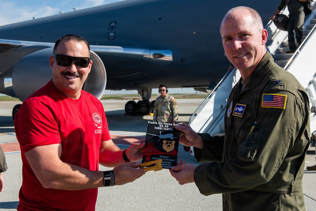 Commander is presented with plaque.