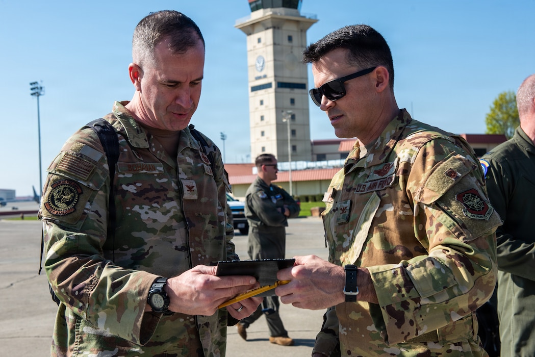Commander is presented with a plaque.