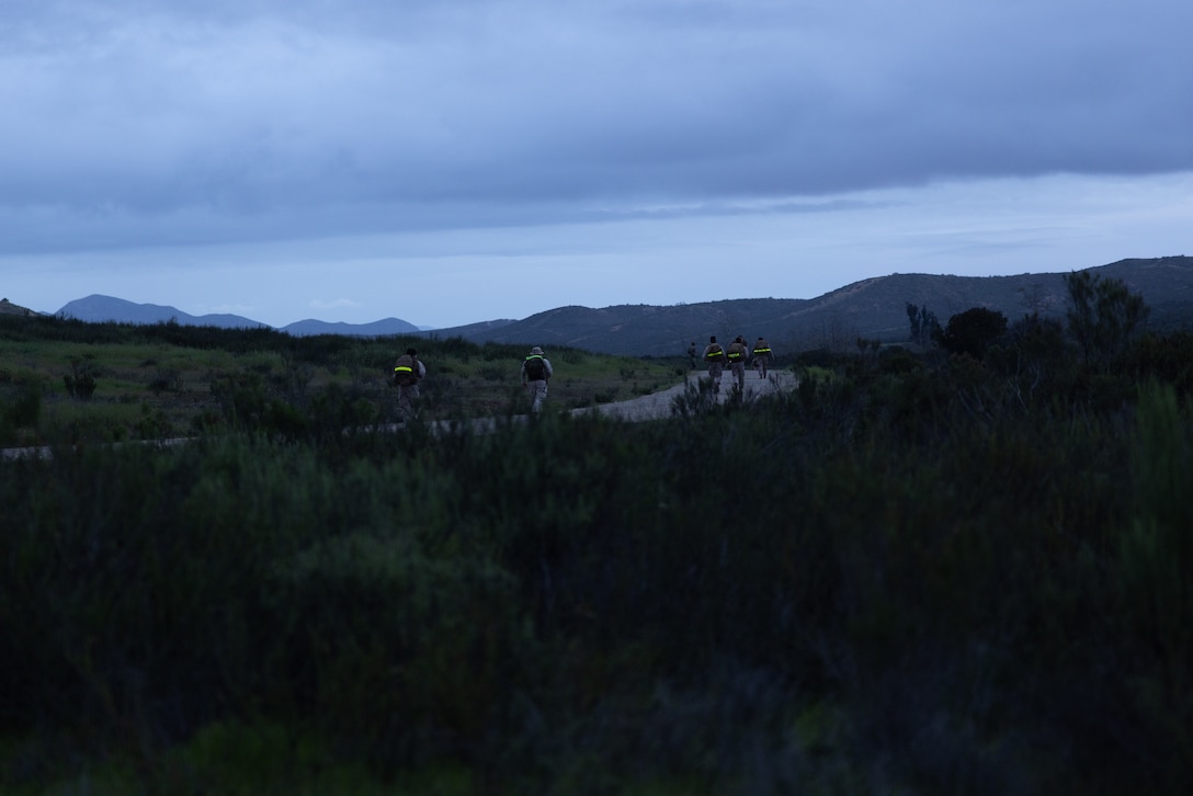 U.S. Marines with Marine Wing Communications Squadron 38, Marine Air Control Group 38, 3rd Marine Aircraft Wing, participate in a Norwegian Foot March at Marine Corps Air Station Miramar, California, Feb. 11, 2026.  The Norwegian Foot March is an 18.64-mile timed event that originated as a test of marching endurance for soldiers in the Norwegian military in 1915 and was conducted to assess Marines’ ability to move under load over across an extended distance, build unit cohesion, and enhance combat readiness. (U.S. Marine Corps photo by Lance Cpl. Samantha Devine)