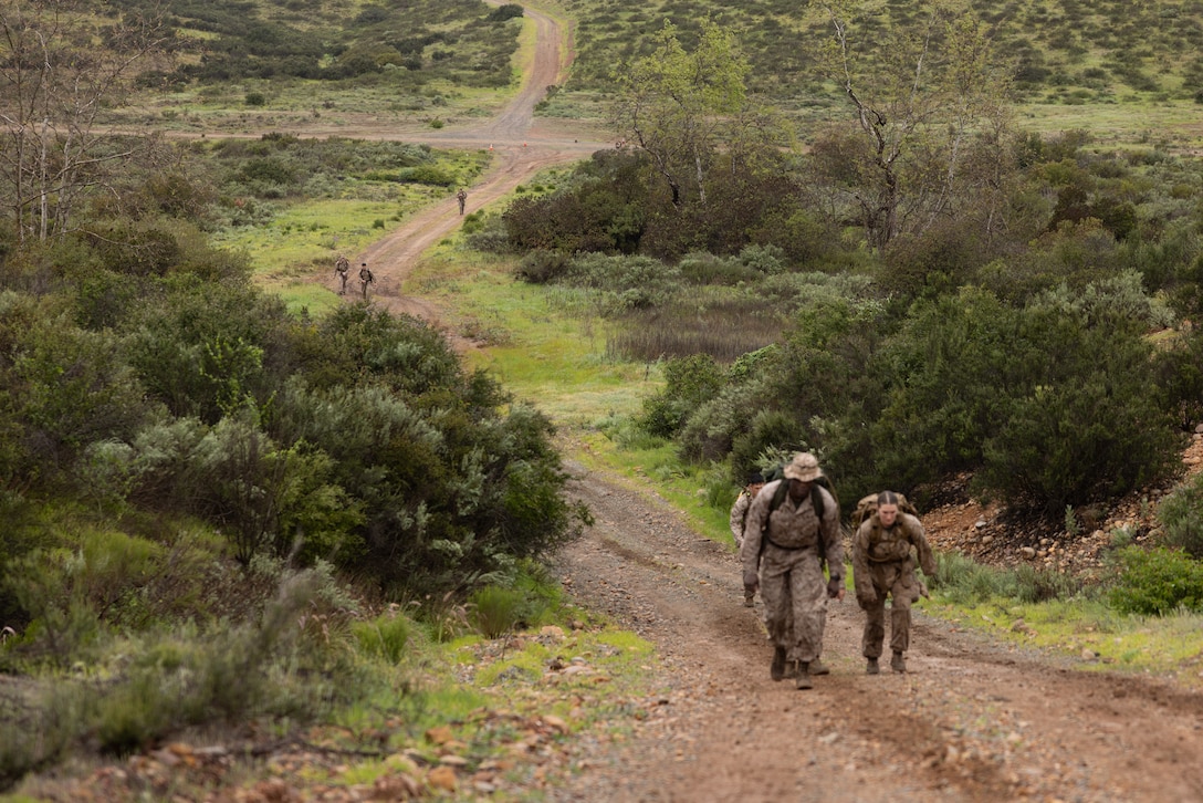 U.S. Marines with Marine Wing Communications Squadron 38, Marine Air Control Group 38, 3rd Marine Aircraft Wing, participate in a Norwegian Foot March at Marine Corps Air Station Miramar, California, Feb. 11, 2026.  The Norwegian Foot March is an 18.64-mile timed event that originated as a test of marching endurance for soldiers in the Norwegian military in 1915 and was conducted to assess Marines’ ability to move under load over across an extended distance, build unit cohesion, and enhance combat readiness. (U.S. Marine Corps photo by Lance Cpl. Samantha Devine)