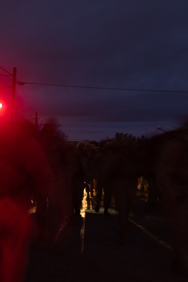 U.S. Marines with Marine Wing Communications Squadron 38, Marine Air Control Group 38, 3rd Marine Aircraft Wing, begin a Norwegian Foot March at Marine Corps Air Station Miramar, California, Feb. 11, 2026. T The Norwegian Foot March is an 18.64-mile timed event that originated as a test of marching endurance for soldiers in the Norwegian military in 1915 and was conducted to assess Marines’ ability to move under load over across an extended distance, build unit cohesion, and enhance combat readiness. (U.S. Marine Corps photo by Lance Cpl. Samantha Devine)