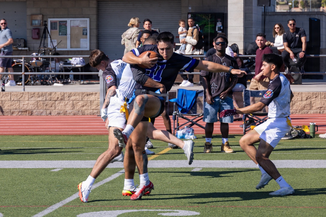 U.S. Marine Corps 2nd Lt. John Trodden, a California native and a ground supply officer with I Marine Expeditionary Force Information Group, plays during the I MIG HMMR Bowl at Marine Corps Base Camp Pendleton, California, Feb. 6, 2026. The HMMR Bowl, named after the I MIG motto of honor, courage, commitment; mission; Marines; readiness, is an annual competition where I MIG Marines compete in flag football and a sports combine events to demonstrate physical prowess, camaraderie, and espirit de corps. (U.S. Marine Corps photo by Lance Cpl. Fabian Ortiz)