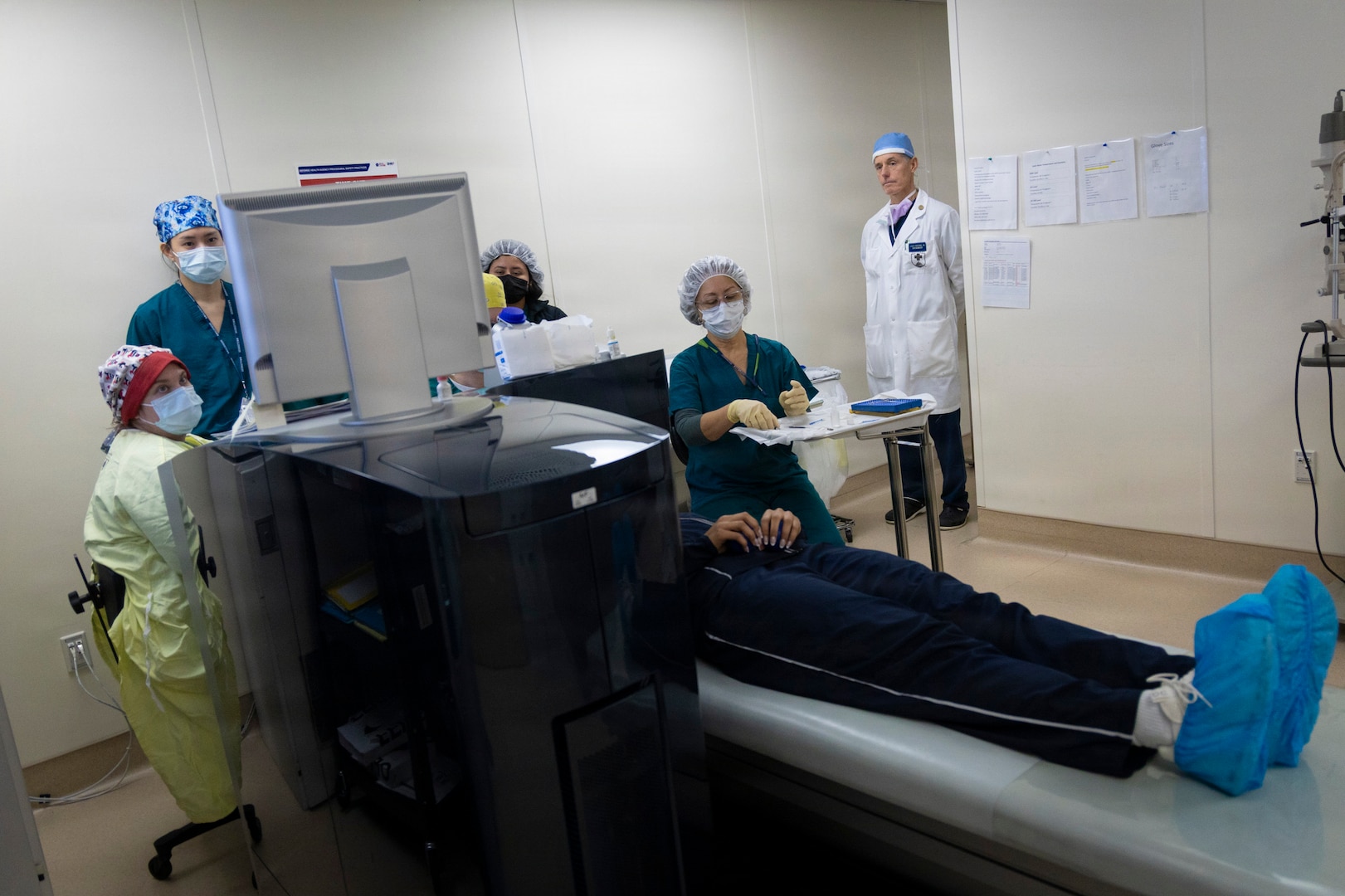 Dr. Joseph Pasternak, director of the Refractive Surgery Center at Walter Reed National Military Medical Center, observes his team during a LASIK surgery in Bethesda, Maryland.