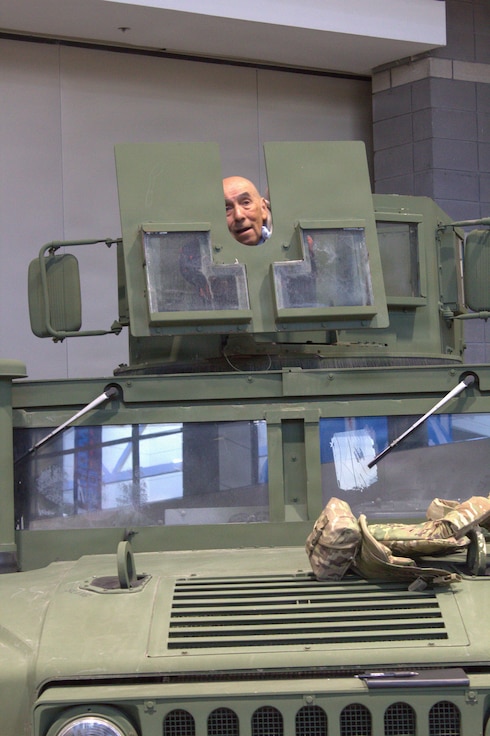 Conrad Buitron stands in the gunners turret of an M1151A1 at the Chicago Auto Show in Chicago on Feb. 11, 2026.