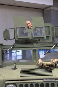 Conrad Buitron stands in the gunners turret of an M1151A1 at the Chicago Auto Show in Chicago on Feb. 11, 2026.