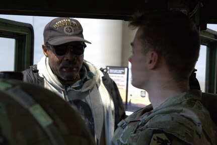Johnny Ross shares his experiences with Spc Christian Lis at the Chicago Auto Show in Chicago.