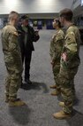 Terry Abma shares his history in the 504th Military Police Battalion with members of the Illinois National Guard at the Chicago Auto Show in Chicago.