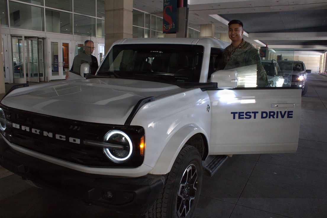 Sgt Luigi Cabantog gets into a Ford Bronco for a test drive at the Chicago Auto Show.