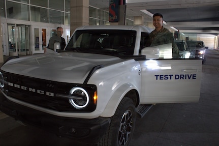 Sgt Luigi Cabantog gets into a Ford Bronco for a test drive at the Chicago Auto Show.