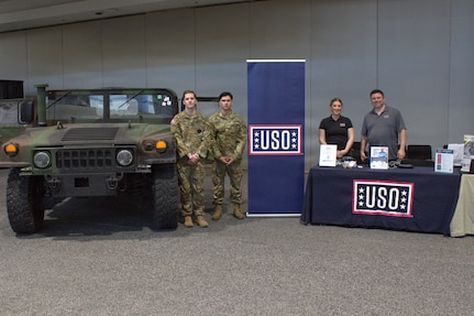 Soldiers pose with staff of the USO at the Chicago Auto Show in Chicago on Feb. 11, 2026.