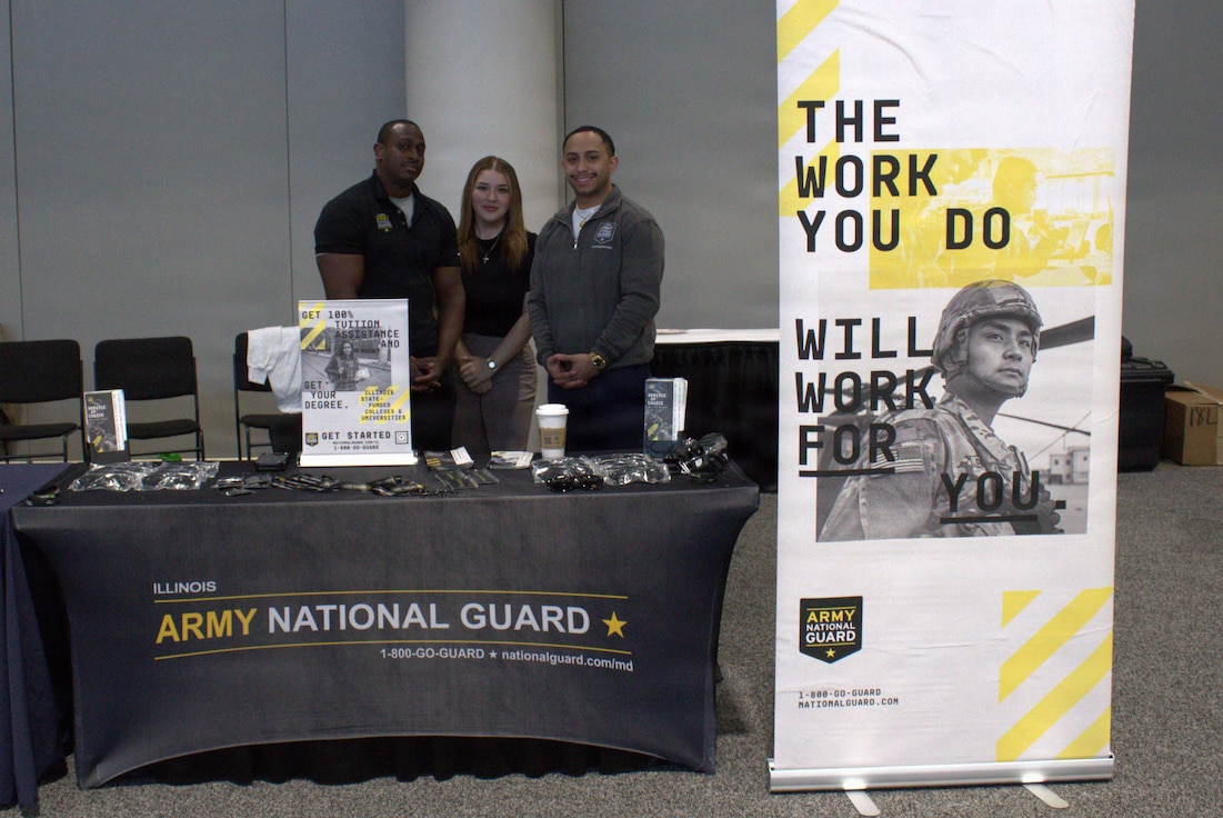 Recruiters with Fox Company Illinois National Guard Recruiting and Retention Command pose for a photo at the Chicago Auto Show.