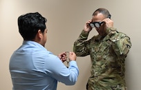 ACC leader tries on augmented reality headset.
