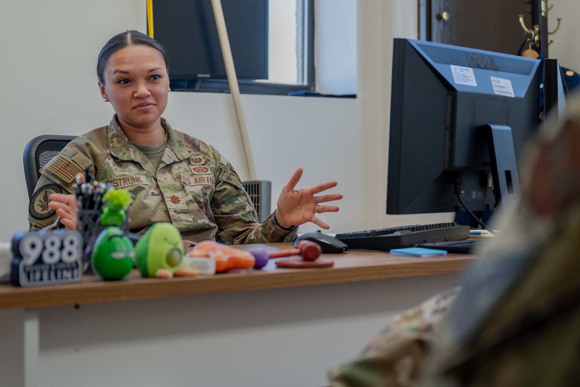 U.S. Air Force Maj. Rachel Sistrunk, Maxwell Area Defense Counsel area defense counsel, talks to an Airman at Maxwell Air Force Base, Alabama, Feb. 12, 2026. By providing confidential legal counsel, the Area Defense Counsel helps Airmen navigate complex situations while maintaining focus on their duties, supporting overall readiness across the wing. (U.S. Air Force photo by Senior Airman Mikayla Cardona)