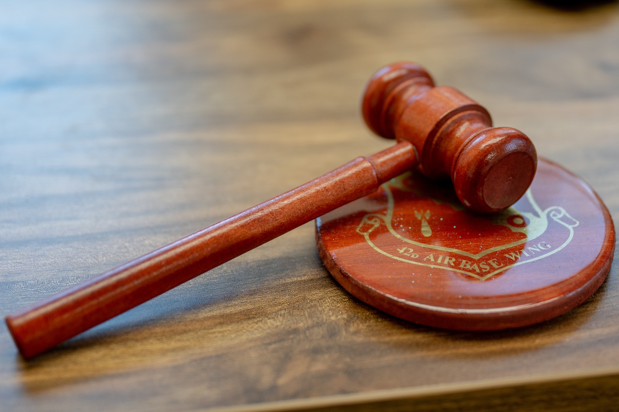 A novelty gavel sits on a desk at Maxwell Air Force Base, Alabama, Feb. 12, 2026. By providing confidential legal counsel, the Area Defense Counsel helps Airmen navigate complex situations while maintaining focus on their duties, supporting overall readiness across the wing. (U.S. Air Force photo by Senior Airman Mikayla Cardona)