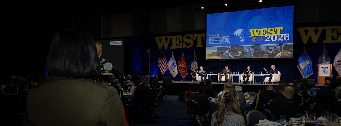 A U.S. Marine asks top sea service leadership a question during the “Sea Service Chiefs Lunch and Town Hall” during the WEST 2026 Conference at the San Diego Convention Center in San Diego, Calif., Feb. 11, 2026. The conference provided Department of War leadership a focused venue to communicate priorities, highlight critical programs, shape joint maritime strategy and engage with partners who influence readiness and capability development. The WEST 2026 theme was “Sustaining Maritime Dominance: Warfighting Readiness for the Future Fight.” (U.S. Marine Corps photo by Cpl. Paschal)