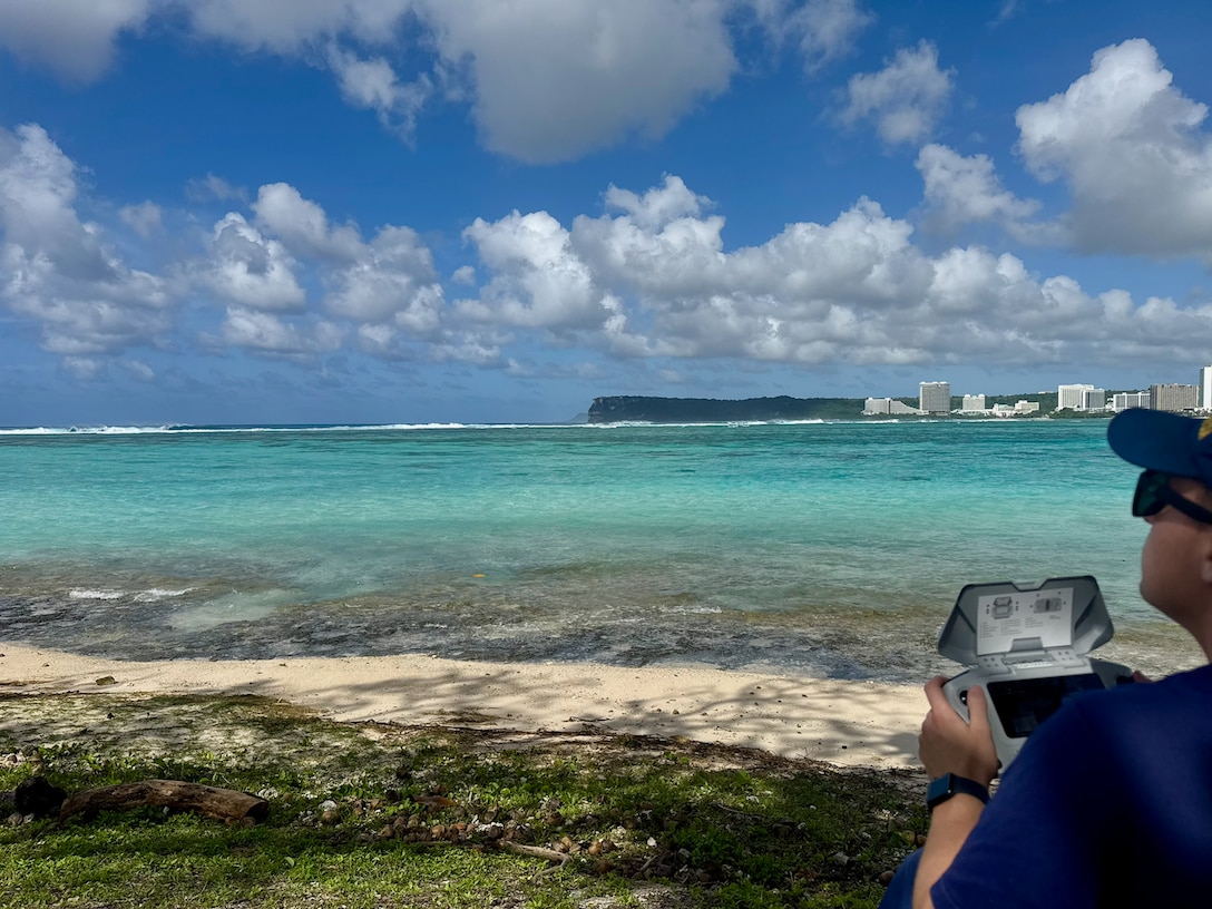 A U.S. Coast Guard petty officer operates an approved drone to search for a missing swimmer off Guam's west side on Feb. 19, 2026. The U.S. Coast Guard suspended the active search Friday at sunset for a 22-year-old man who was swept beyond the reef line while swimming at Tanguisson Beach on Tuesday evening. He remains missing. U.S. Coast Guard, U.S. Navy, and Guam National Guard crews conducted 26 search patterns over three days, covering 637 square nautical miles, in addition to substantial efforts by Guam Fire Rescue crews. (U.S. Coast Guard photo by Petty Officer 1st Class Christopher Farrell)
