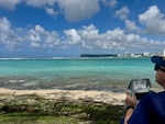 A U.S. Coast Guard petty officer operates an approved drone to search for a missing swimmer off Guam's west side on Feb. 19, 2026. The U.S. Coast Guard suspended the active search Friday at sunset for a 22-year-old man who was swept beyond the reef line while swimming at Tanguisson Beach on Tuesday evening. He remains missing. U.S. Coast Guard, U.S. Navy, and Guam National Guard crews conducted 26 search patterns over three days, covering 637 square nautical miles, in addition to substantial efforts by Guam Fire Rescue crews. (U.S. Coast Guard photo by Petty Officer 1st Class Christopher Farrell)