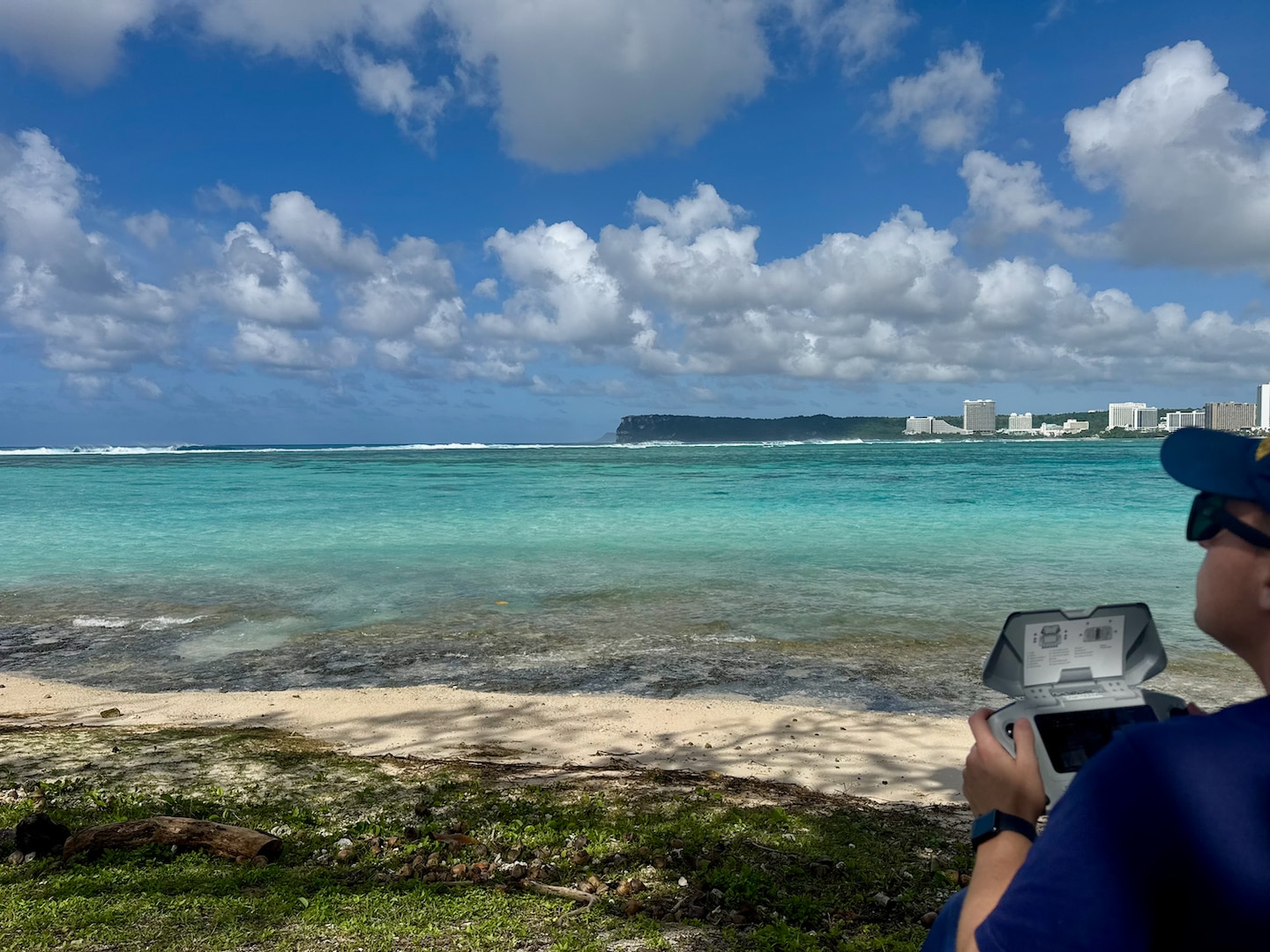 A U.S. Coast Guard petty officer operates an approved drone to search for a missing swimmer off Guam's west side on Feb. 19, 2026. The U.S. Coast Guard suspended the active search Friday at sunset for a 22-year-old man who was swept beyond the reef line while swimming at Tanguisson Beach on Tuesday evening. He remains missing. U.S. Coast Guard, U.S. Navy, and Guam National Guard crews conducted 26 search patterns over three days, covering 637 square nautical miles, in addition to substantial efforts by Guam Fire Rescue crews. (U.S. Coast Guard photo by Petty Officer 1st Class Christopher Farrell)