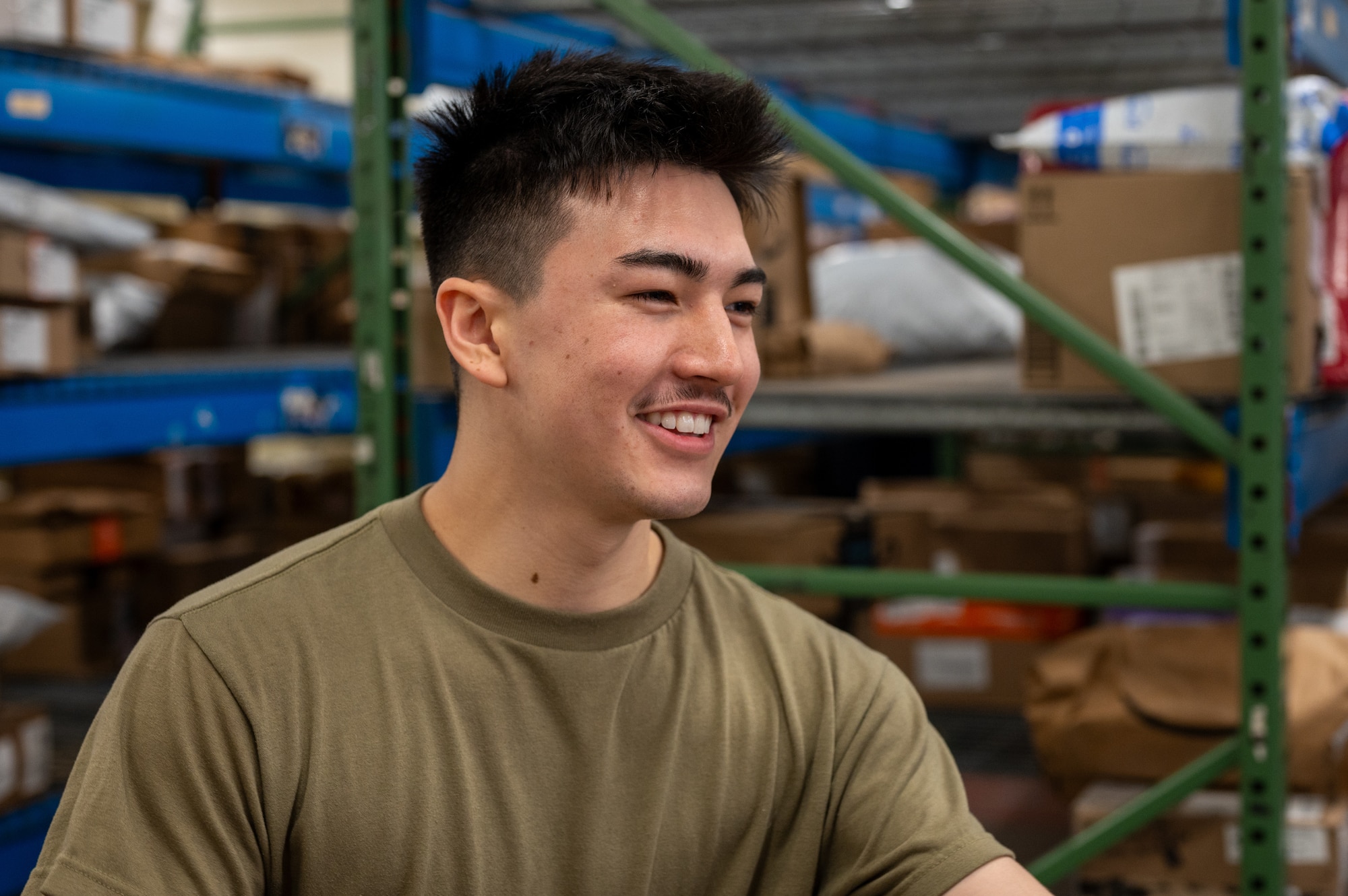U.S. Air Force Airman 1st Class Kento Baumann, 718th Force Support Squadron postal clerk, loads outgoing mail onto a delivery truck at Kadena Air Base, Japan, Jan. 8, 2026. The 718th FSS ensures timely and secure delivery of packages, directly supporting service members’ readiness. (U.S. Air Force photo by Airman 1st Class Francisco Huerta)