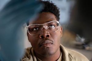 U.S. Air Force Senior Airman Thompson Tyler, 33rd Rescue Generation Squadron HH-60W Jolly Green II phase crew chief, applies sealant to an HH-60W on Kadena Air Base, Japan, Jan. 08, 2026. Phase maintenance ensures aircraft structural integrity and reliability, enabling the 33rd RGS and 33rd Rescue Squadron to maintain combat-ready rescue capabilities across the Indo-Pacific. (U.S. Air Force photo by Airman 1st Class Nathaniel Jackson)