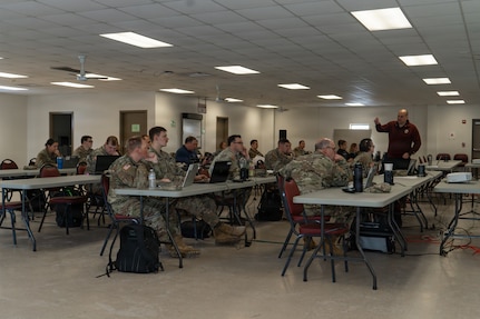 Pennsylvania National Guard Soldiers participate in an Artificial Intelligence 201 class at Fort Indiantown Gap, Pennsylvania, Feb. 11-12, 2026. The course, taught by U.S. Army War College faculty, focused on responsible AI use and practicing critical thinking skills for effective AI prompting. (U.S. Army National Guard photo by Sgt. Kayden Bedwell)
