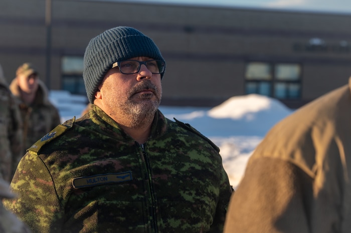 Royal Canadian Air Force Sgt. Lyle Multon, a Noncommissioned Officer Academy student, stands in formation during a retreat ceremony at the Elmendorf Professional Military Education Center on Joint Base Elmendorf-Richardson, Alaska, Jan. 21, 2026. The collaboration with partner nations strengthens the impact of the curriculum by integrating the experience and perspective of foreign military operatives to enhance interoperability. (U.S. Air Force photo by Airman 1st Class Theodore Gowdy)