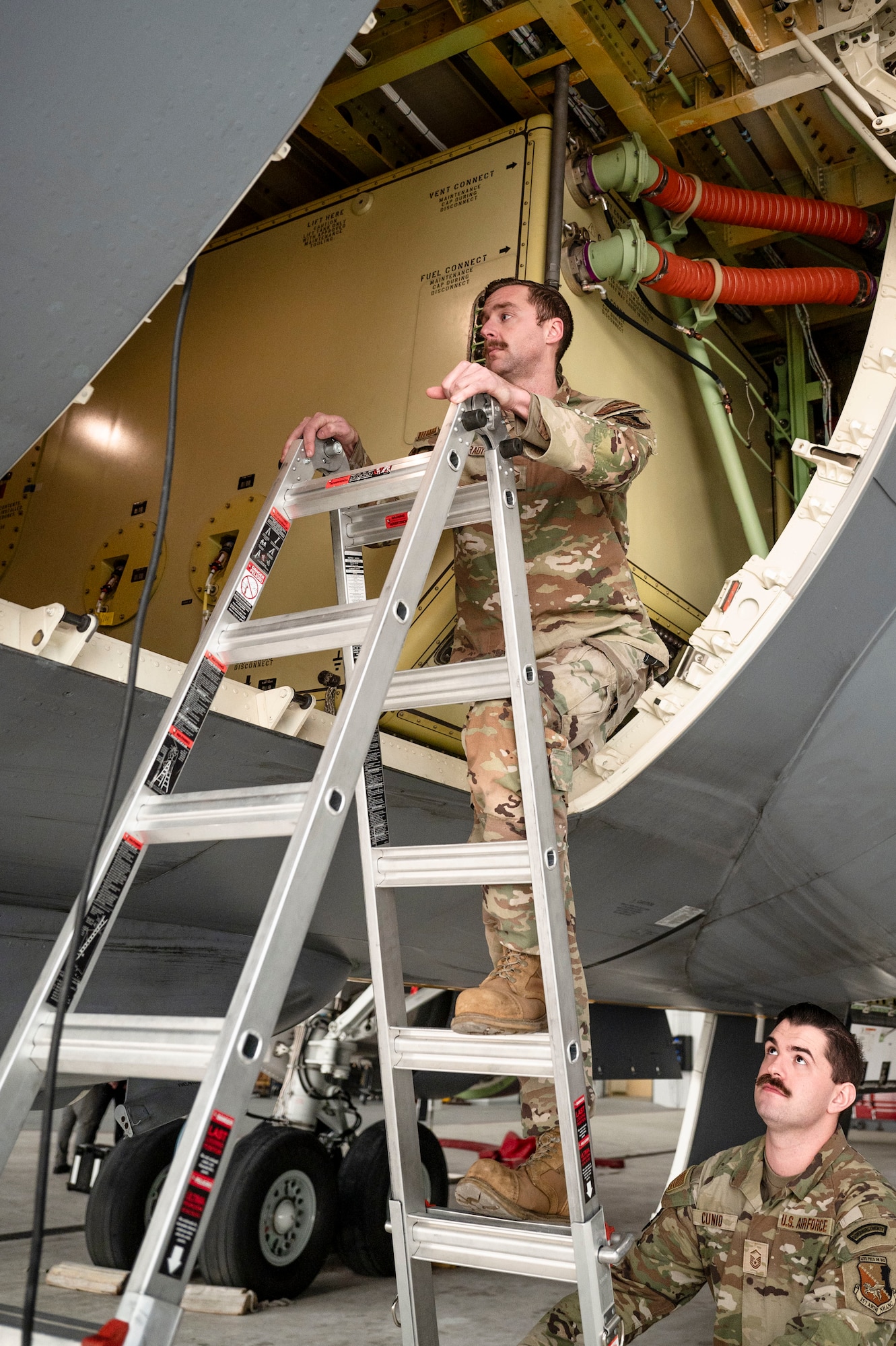 A Crew Chief inspect KC-46A Pegasus aircraft