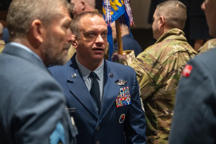 U.S. Air Force Chief Master Sgt. Adam Petersen, Elmendorf Professional Military Education Center commandant, speaks with representatives from the Royal Danish Air Force on Joint Base Elmendorf-Richardson, Alaska, Feb. 10, 2026. The Elmendorf PME Center hosted members of the Danish and Canadian armed forces for the Noncommissioned Officer Academy. (U.S. Air Force photo by Airman 1st Class Theodore Gowdy)