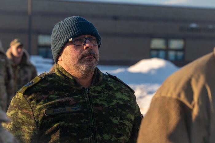 Royal Canadian Air Force Sgt. Lyle Multon, a Noncommissioned Officer Academy student, stands in formation during a retreat ceremony at the Elmendorf Professional Military Education Center on Joint Base Elmendorf-Richardson, Alaska, Jan. 21, 2026. The collaboration with partner nations strengthens the impact of the curriculum by integrating the experience and perspective of foreign military operatives to enhance interoperability. (U.S. Air Force photo by Airman 1st Class Theodore Gowdy)