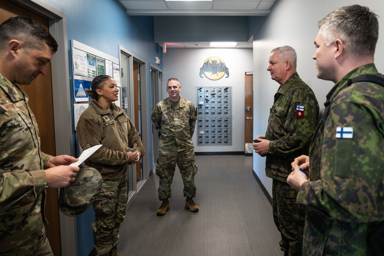 military members standing talking