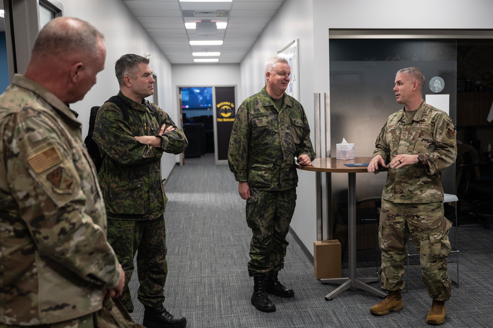 military members standing talking