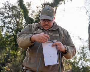 An Airman sets up communications equipment