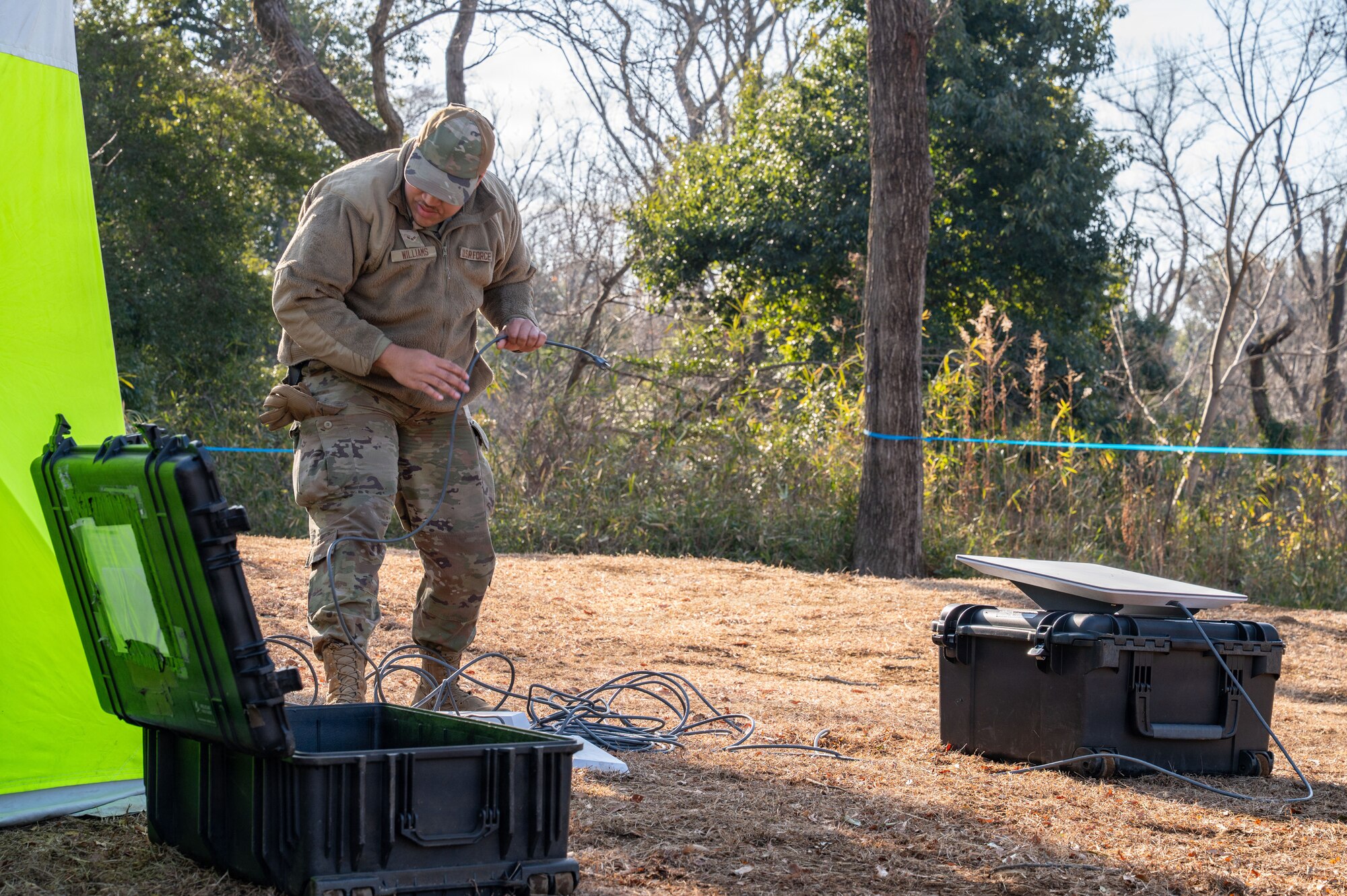 An Airman sets up communications equipment