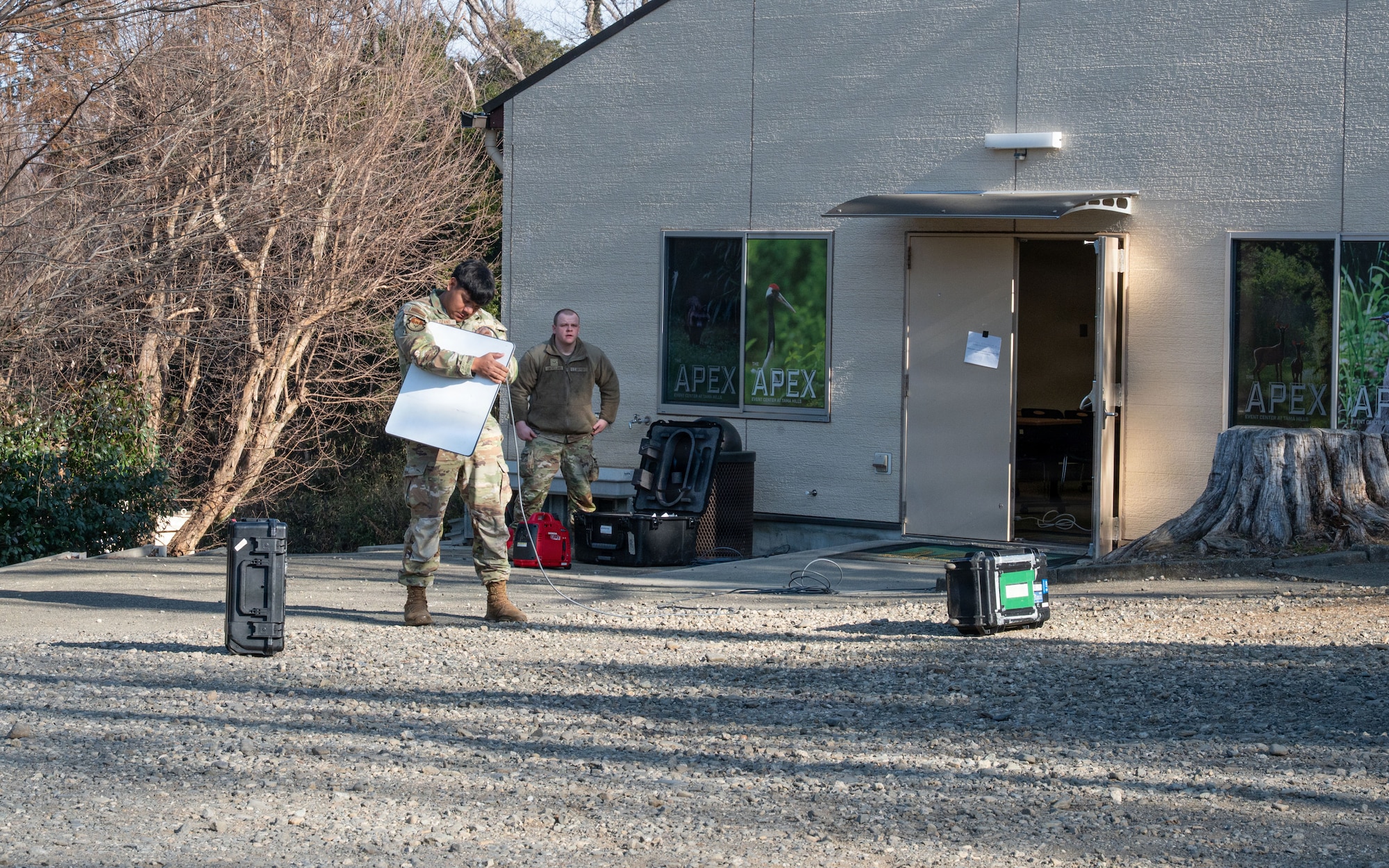 An Airman sets up a satellite