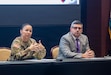 Maj. Gen. Lori Robinson, commanding general of the U.S. Army Aviation and Missile Command (AMCOM), and Don Nitti, deputy to the commanding general, discuss the workforce climate during the command's quarterly town hall in the Sparkman Center on Redstone Arsenal, Ala., on Feb. 10.
