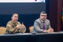Maj. Gen. Lori Robinson, commanding general of the U.S. Army Aviation and Missile Command (AMCOM), and Don Nitti, deputy to the commanding general, discuss the workforce climate during the command's quarterly town hall in the Sparkman Center on Redstone Arsenal, Ala., on Feb. 10.