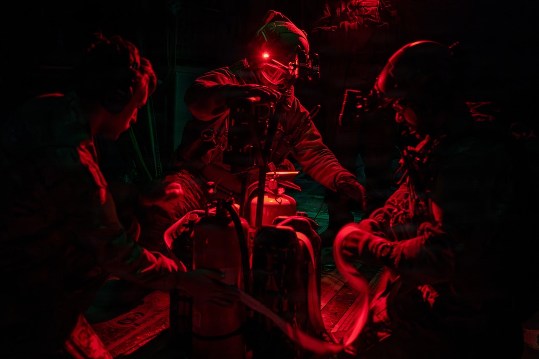 Airmen in red light