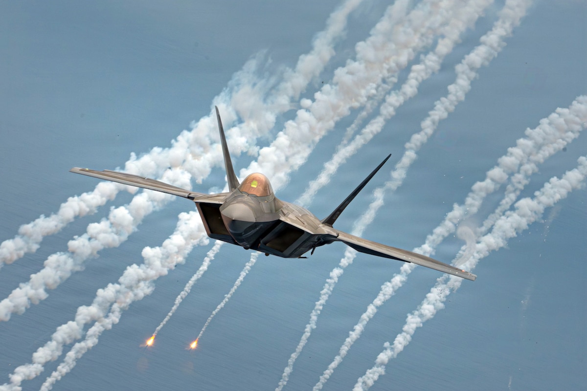 An F-22A Raptor from the 154th Wing, Hawaii Air National Guard, deploys flares during exercise Sentry Aloha 26-1 over the Hawaiian Islands, Jan. 22, 2026. Flares are defensive countermeasures designed to decoy infrared-guided threats by creating an intense heat signature for a missile to follow, drawing it safely away from the aircraft. (U.S. Air National Guard photo by Senior Airman Michael Swingen)