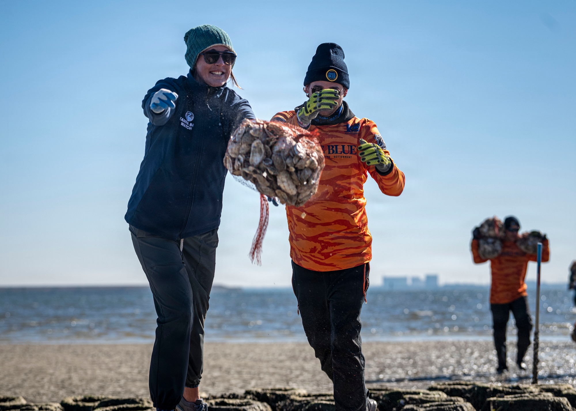Volunteers from MacDill Air Force Base, the National Hockey League, Tampa Bay Watch, and Force Blue contribute to shoreline restoration efforts during the MacDill Living Shoreline Project at MacDill Air Force Base, Florida, Jan. 29, 2026. The project brings together base personnel and community partners to repurpose donated oyster shells into protective shoreline infrastructure. Since its establishment in 2003, the living shoreline has engaged more than 8,000 volunteers, including military members, community organizations and local schoolchildren, demonstrating the lasting impact of collaborative environmental stewardship. (U.S. Air Force photo by Airman 1st Class Monique Stober)
