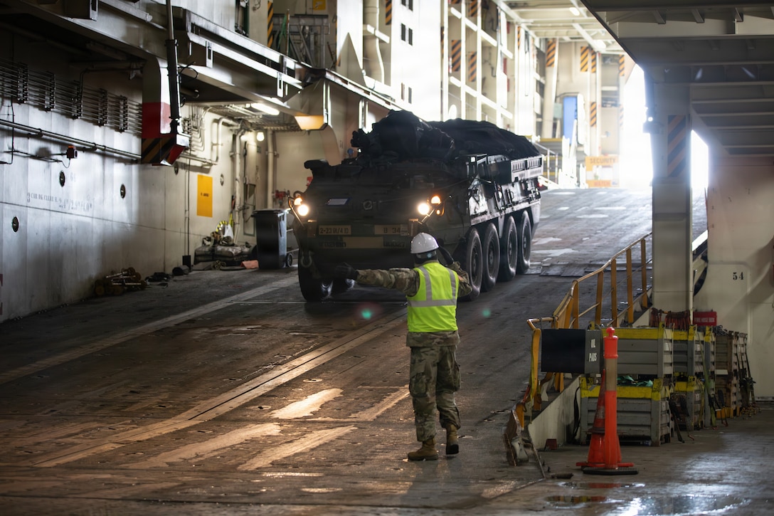 U.S. Soldiers assigned to 837th Transportation Battalion offload containers and upload vehicles and equipment at the Busan, South Korea, port Feb. 1, 2026. With the help of U.S. Army Transportation, U.S. Transportation Command conducts Operation Turbo Fusion, which demonstrates how the military integrates multiple modes of transportation to move cargo around the globe, even in contested environments. 2nd Stryker Brigade Combat Team, 2nd Infantry Division, equipment and containers were offloaded while vehicles from 1st Stryker Brigade Combat Team, 4th Infantry Division, were loaded onto the ship. 2SBCT falls under the 2nd Infantry Division contingent at Joint Base Lewis-McChord, Washington, and is replacing 1SBCT, 4ID, as the new U.S. Army Korea Rotational Force that will train with the Republic of Korea Army in support of the ROK-US alliance and contribute to readiness in the Indo-Pacific region.