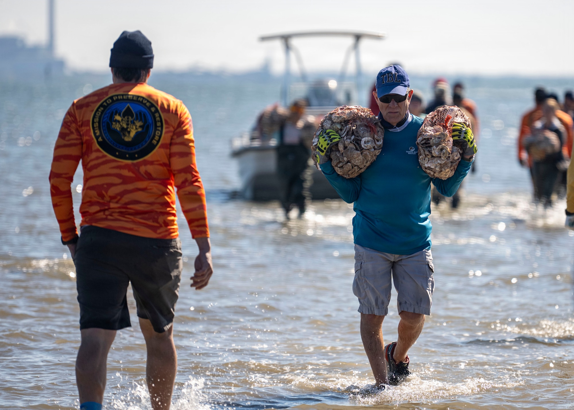 Volunteers from MacDill Air Force Base, the National Hockey League, Tampa Bay Watch, and Force Blue participate in the creation and placement of oyster shell bags during the Living Shoreline Project at MacDill Air Force Base, Florida, Jan. 29, 2026. The effort supports Phase I of the Living Shoreline Supplemental Project, a modification to the original shoreline restoration established in 2003. The oyster shells were donated by local restaurants through the Shells for Shorelines program. This partnership reinforces coastal resilience while offering base personnel opportunities to support efforts that directly impact mission readiness. The living shoreline also serves as a space for recreation and environmental education, benefiting both the installation and the surrounding community. (U.S. Air Force photo by Airman 1st Class Monique Stober)