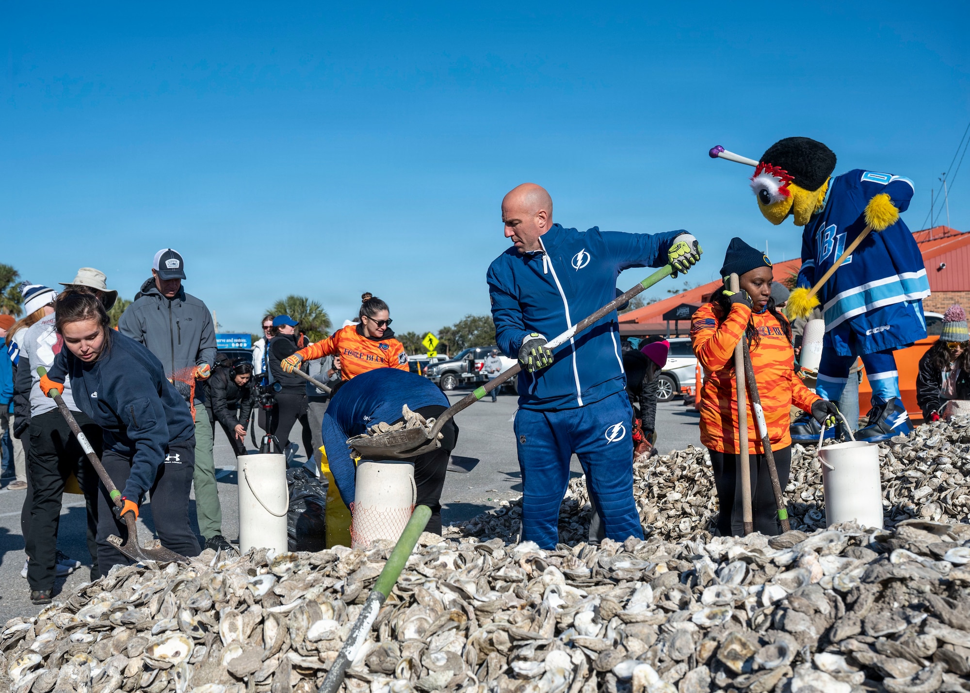 Volunteers from MacDill Air Force Base, the National Hockey League, Tampa Bay Watch, and Force Blue participate in the creation and placement of oyster shell bags during the Living Shoreline Project at MacDill Air Force Base, Florida, Jan. 29, 2026. The effort supports Phase I of the Living Shoreline Supplemental Project, a modification to the original shoreline restoration established in 2003. The oyster shells were donated by local restaurants through the Shells for Shorelines program. This partnership reinforces coastal resilience while offering base personnel opportunities to support efforts that directly impact mission readiness. The living shoreline also serves as a space for recreation and environmental education, benefiting both the installation and the surrounding community. (U.S. Air Force photo by Airman 1st Class Monique Stober)