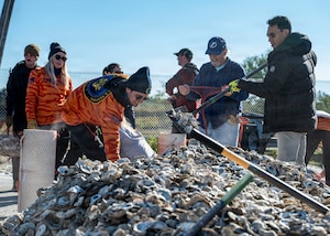 Volunteers from MacDill Air Force Base, the National Hockey League, Tampa Bay Watch, and Force Blue participate in the creation and placement of oyster shell bags during the Living Shoreline Project at MacDill Air Force Base, Florida, Jan. 29, 2026. The effort supports Phase I of the Living Shoreline Supplemental Project, a modification to the original shoreline restoration established in 2003. The oyster shells were donated by local restaurants through the Shells for Shorelines program. This partnership reinforces coastal resilience while offering base personnel opportunities to support efforts that directly impact mission readiness. The living shoreline also serves as a space for recreation and environmental education, benefiting both the installation and the surrounding community. (U.S. Air Force photo by Airman 1st Class Monique Stober)