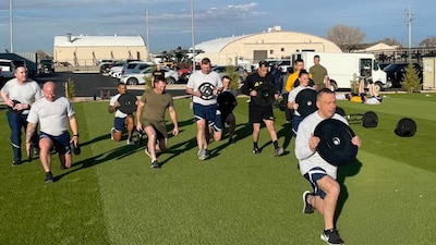 Maj. Gen. Lyle K. Drew, Acting Director of the Defense Threat Reduction Agency (DTRA), and Sgt. Maj. Daniel Mangrum, DTRA Senior Enlisted Leader participate in physical training (PT) session with military personnel from DTRA-West.