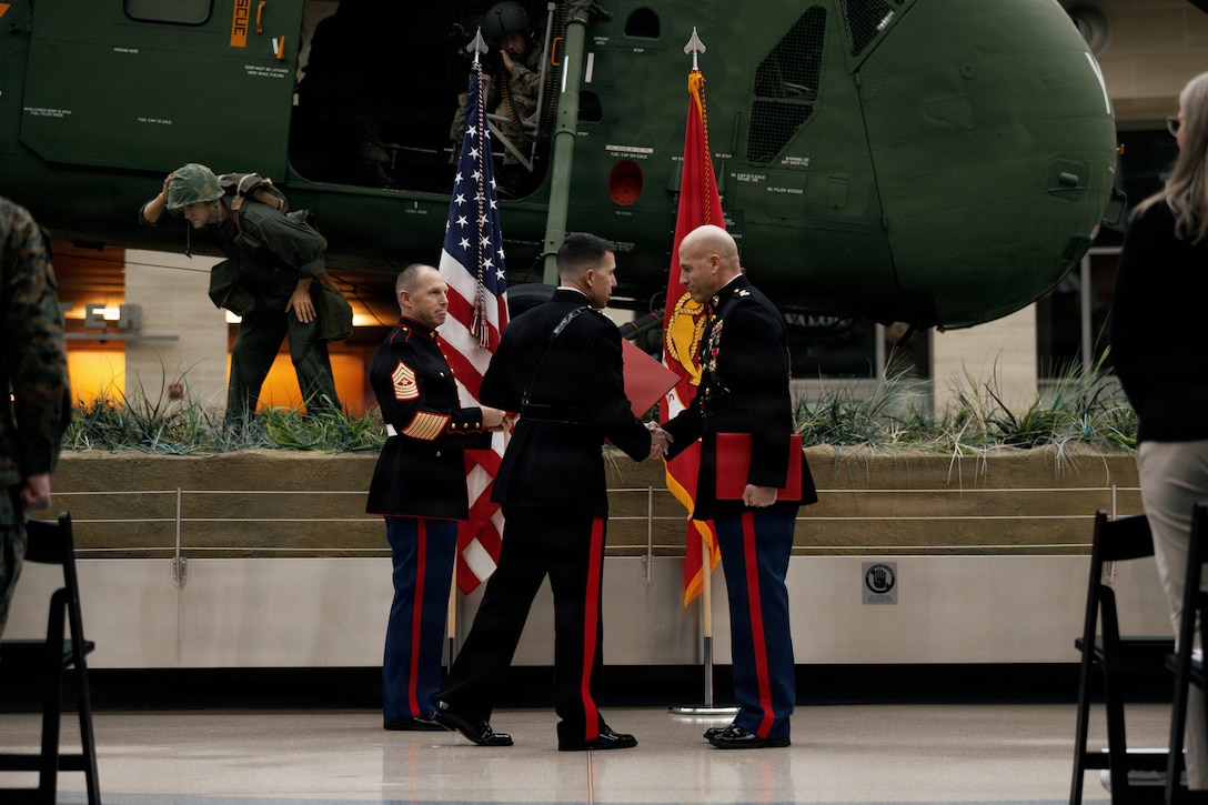 U.S. Marine Corps Sgt. Maj. Ryan A. Gnecco, sergeant major, Training and Education Command, left, Lt. Gen. Benjamin T. Watson, commanding general, TECOM, deputy commandant, Training and Education, center, and Chief Warrant Officer 5 Gerald Eggers participate in a retirement ceremony at the National Museum of the Marine Corps, Triangle, Virginia, Jan. 9, 2026. Eggers retired after 35 years of honorable service to the United States Marine Corps and was awarded the Legion of Merit medal during the ceremony. (U.S. Marine Corps photo by Cpl. Joshua Barker)