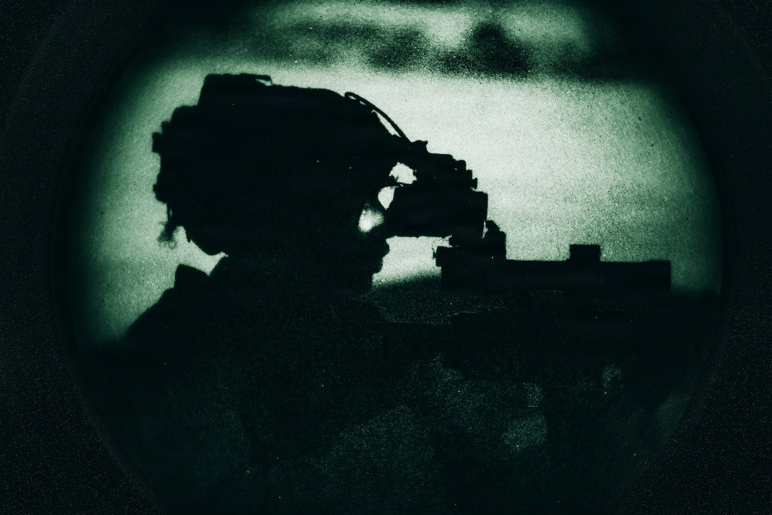 A U.S. Marine with Lima Company, Battalion Landing Team 3/5, 11th Marine Expeditionary Unit, sights in on an M27 infantry automatic rifle during a raid near Yuma, Arizona, Jan. 31, 2026. The 11th MEU is currently underway aboard the Boxer Amphibious Ready Group in the U.S. 3rd Fleet area of operations conducting integrated training that enhances lethality and warfighting readiness. (U.S. Marine Corps photo by Lance Cpl. Luke Rodriguez)