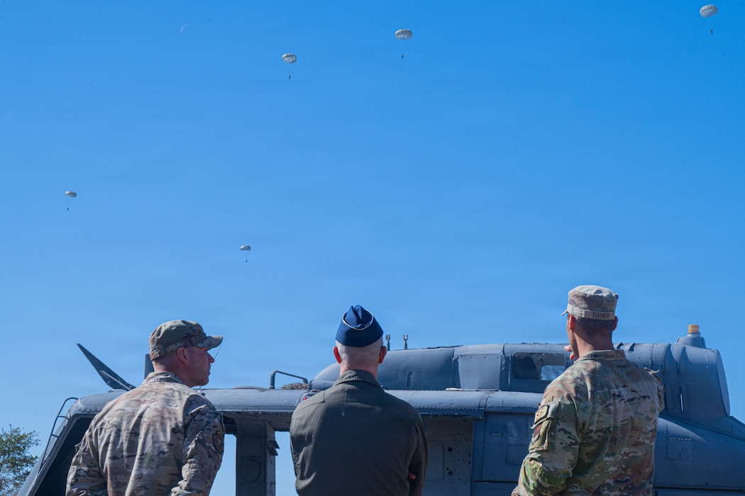 Photo of people looking into the sky.