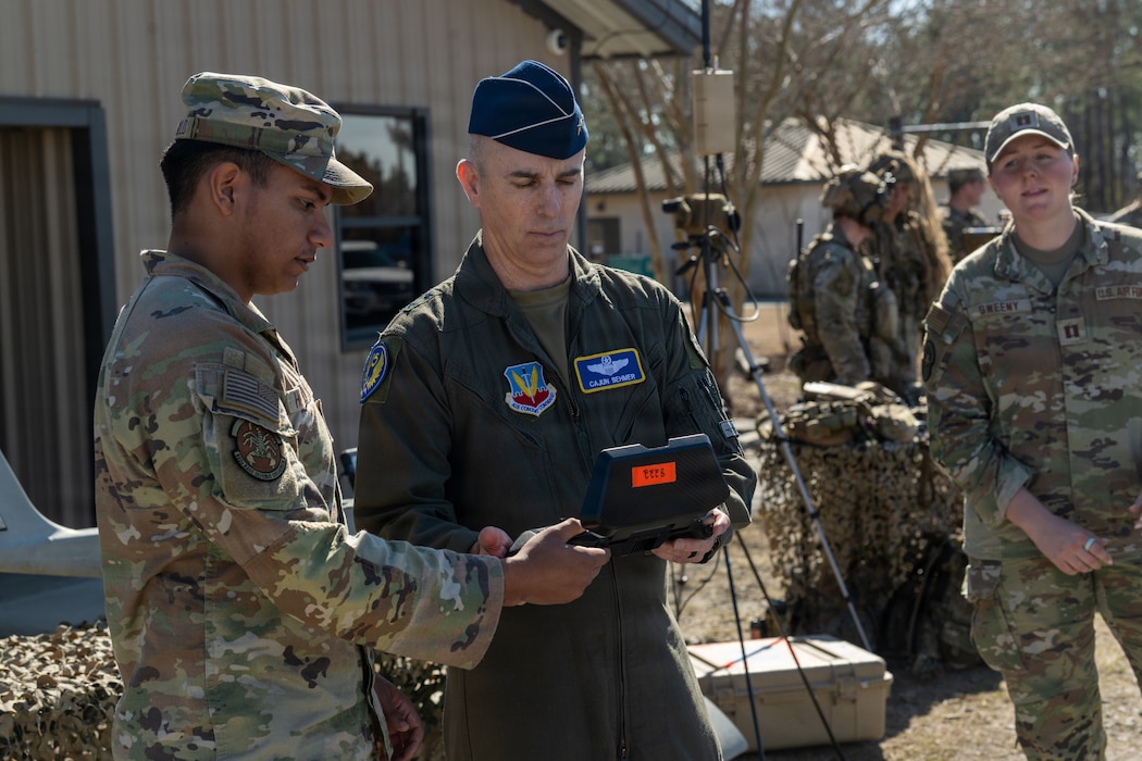 Man holding controller for a drone.