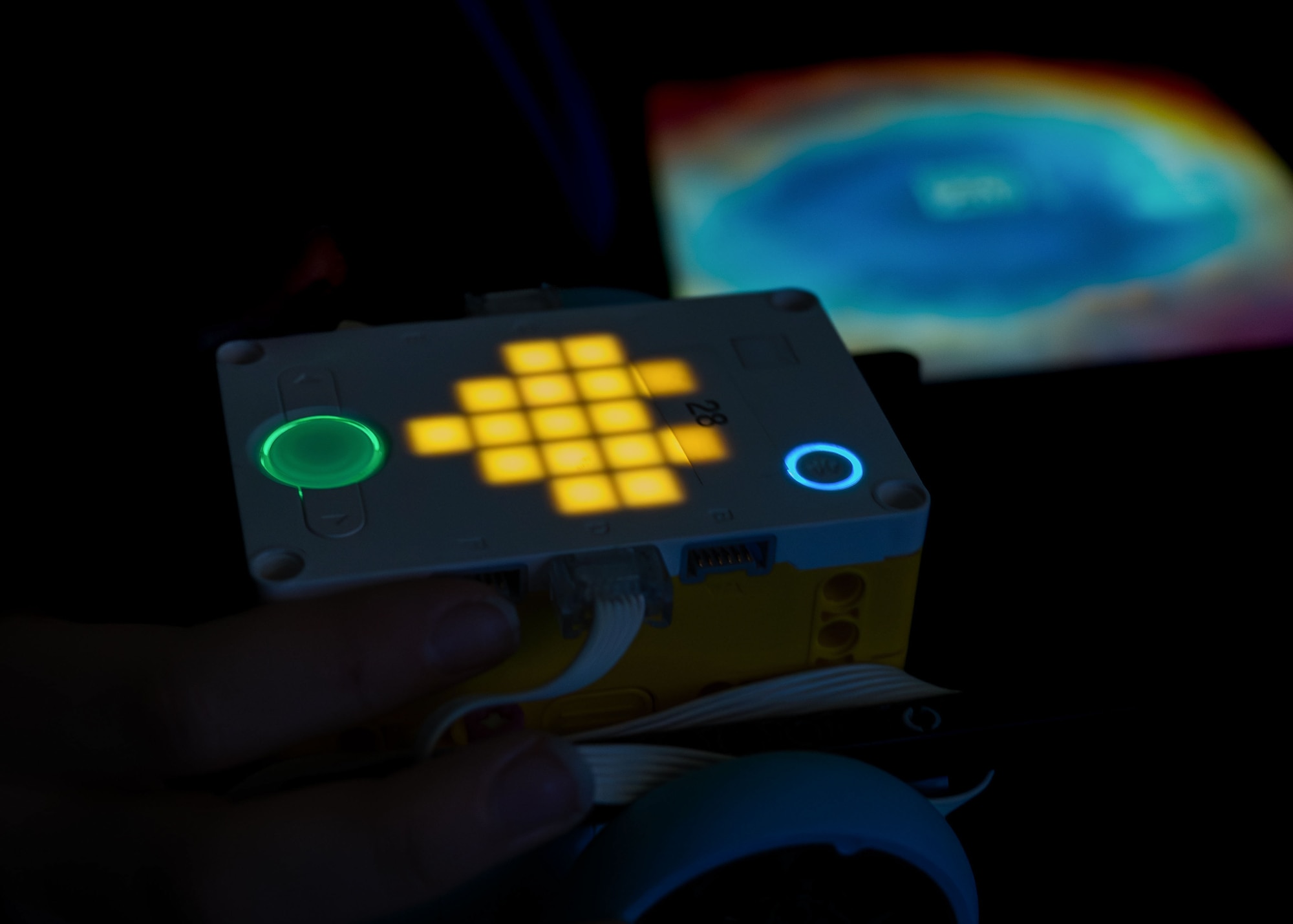 A student holds a programmable robot at Maxwell Air Force Base, Alabama, Feb. 11, 2026.